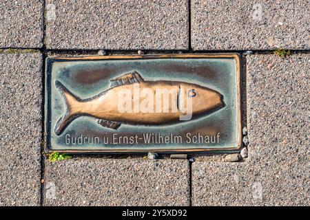 A brass herring stone bearing the names "Gudrun and Ernst-Wilhelm Schauf" is set into the pavement of Kappeln's pedestrian zone. Citizens could have themselves immortalised this way in return for a donation. The Rotary Club campaign ended after a passer-by slipped on one of the stones. Schleswig-Holstein, Germany. ## Ostsee Batch 07 (` EM 4160` bis ` EM 4234`, 28 Bilder, 2.–3. September 2024, Kappeln an der Schlei und Arnis) Stock Photo